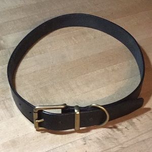 Black leather belt with gold buckle.